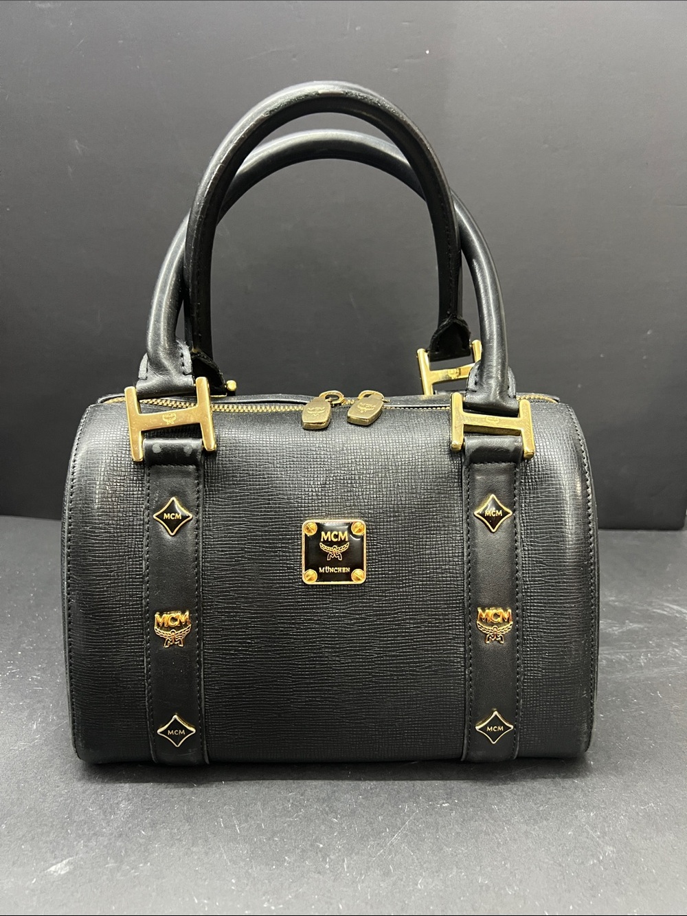 MCM Black Leather Satchel with Gold Hardware Accents